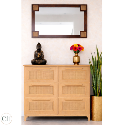 Large wooden shoe rack in light wood tone, with rattan panels, decorative items and a mirror on the wall | CUSTHUM