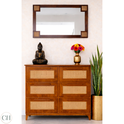 Large wooden shoe rack with rattan panels, decorative items and a mirror on the wall | CUSTHUM
