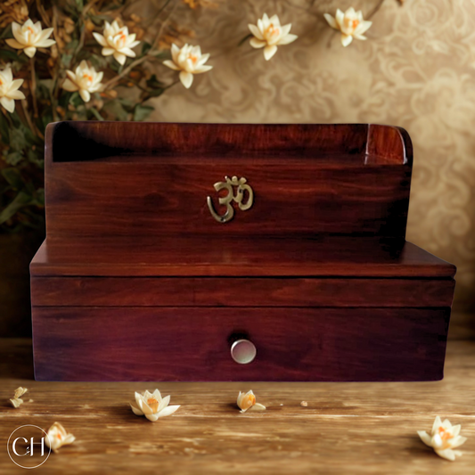 Compact wooden puja mandir with brass AUM, placed against flowery background