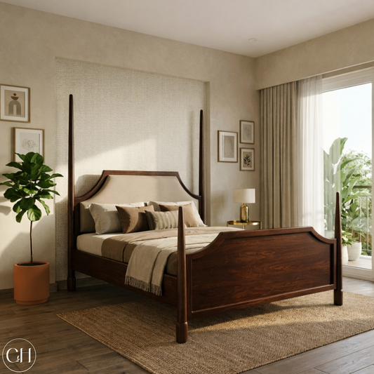 CustHum four-poster bed in dark wood tone, shown in a bedroom with a plant and framed pictures on the wall.