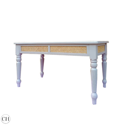 CustHum - Coffee table with glossy laminated top, rattan accent on apron, turned legs (ISO, white background)