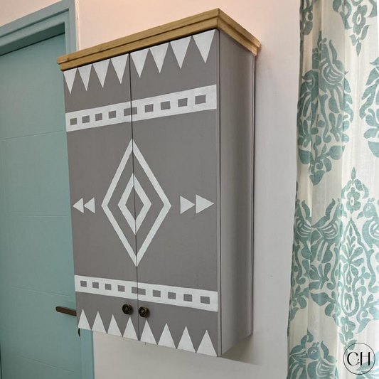 CustHum - Grey wall-mounted cabinet with Aztec art motif on doors (ISO closed view)