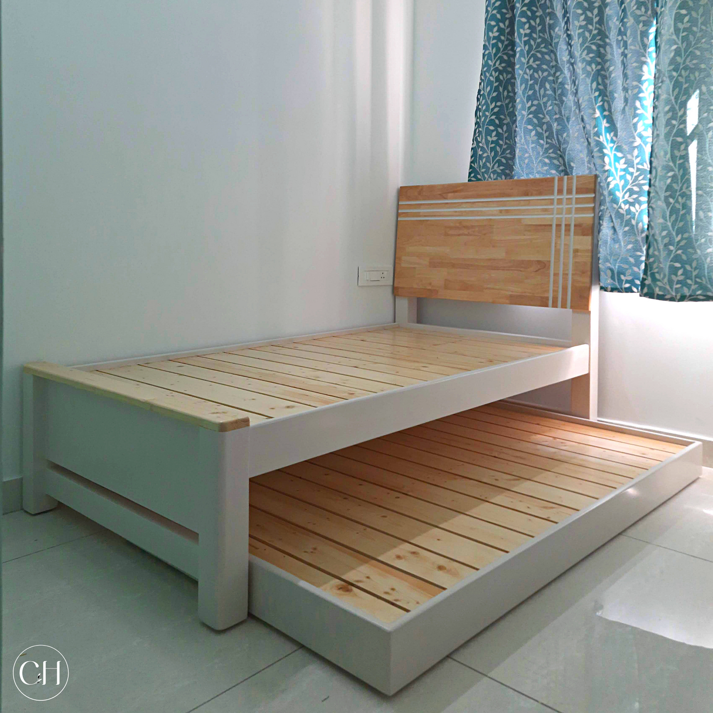 CustHum Stardust - solid wood bed with trundle in natural pine and white finish and headboard with inlaid paintwork (ISO, trundle open)